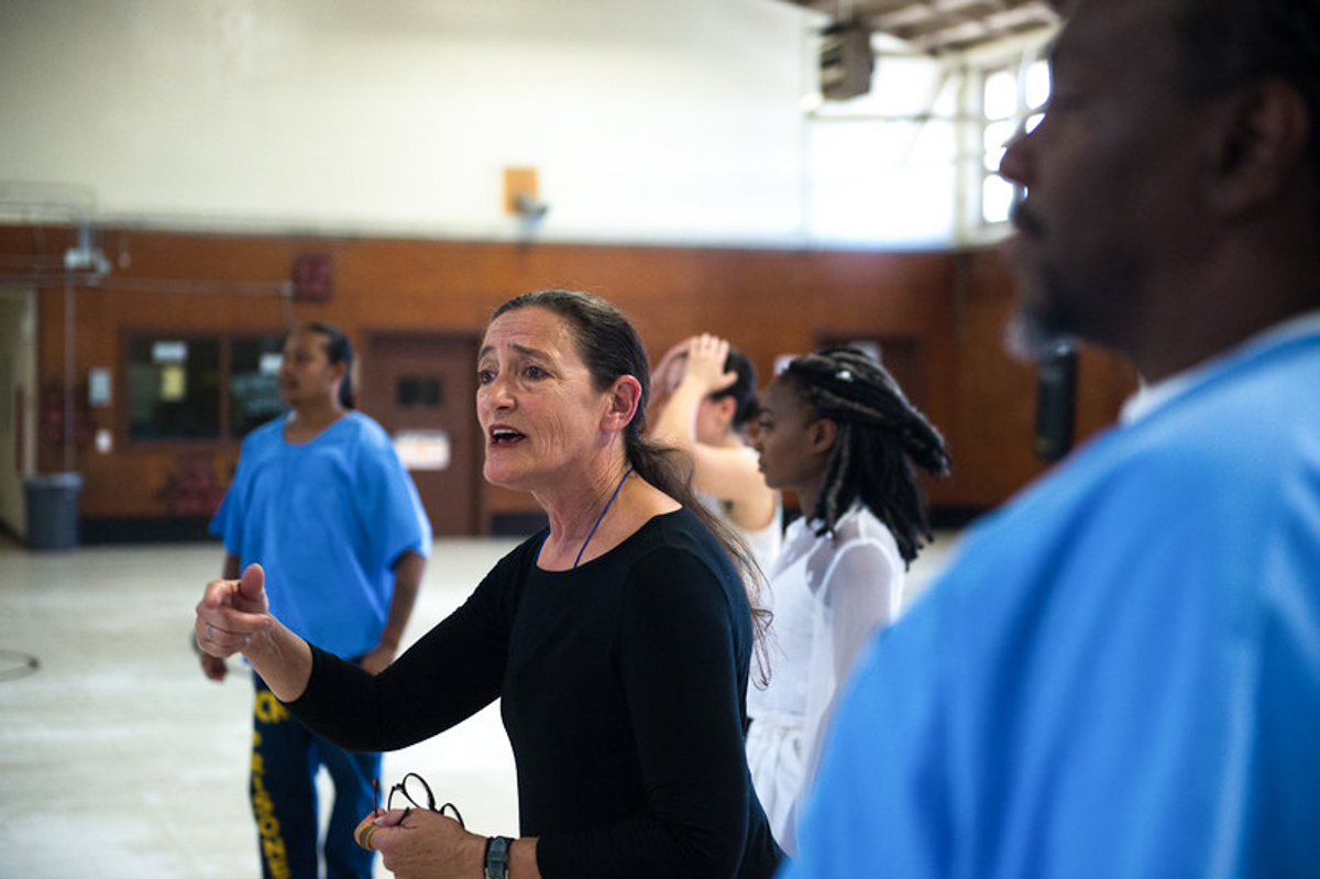 Suchi Branfman dances with incarcerated men at the California Rehabilitation Center in Norco, CA. Photo by Cooper Bates.